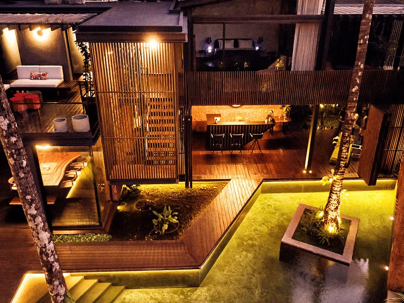 Aerial exterior of villa in palms by v escapes