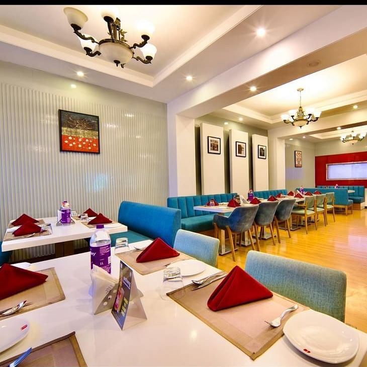 Dining area of Lords Plaza Ankleshwar with comfortable seating and modern interiors