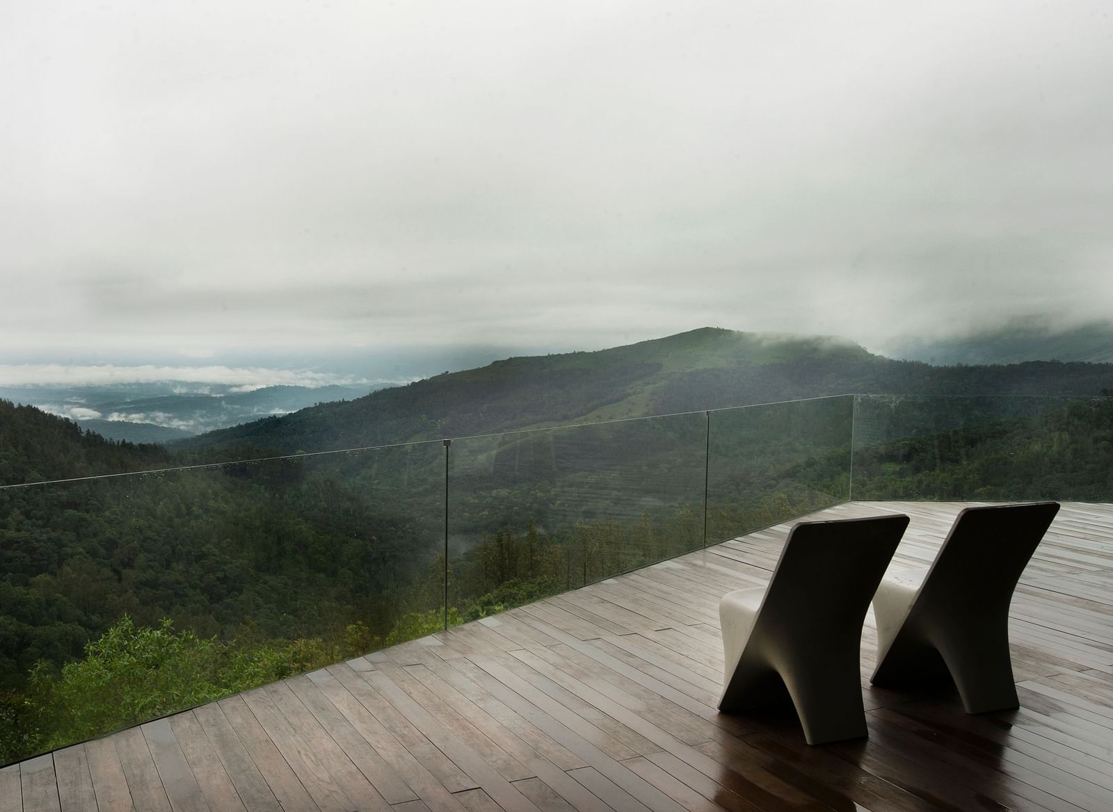 An outdoor seating area with two chairs and views of the mountain in front at Stanley Revelation. 