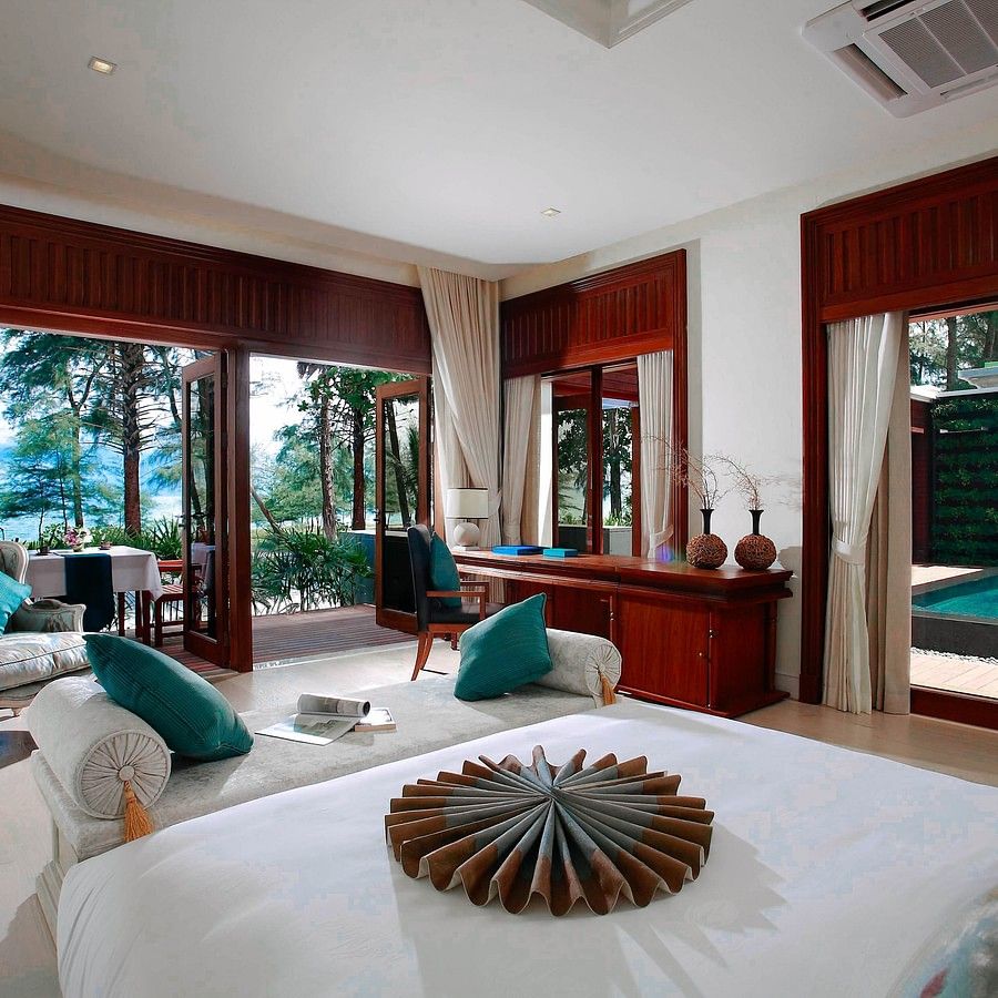 alt-text image of the modern bedroom with teal coloured cushioning - two bedroom private pool beachfront villa