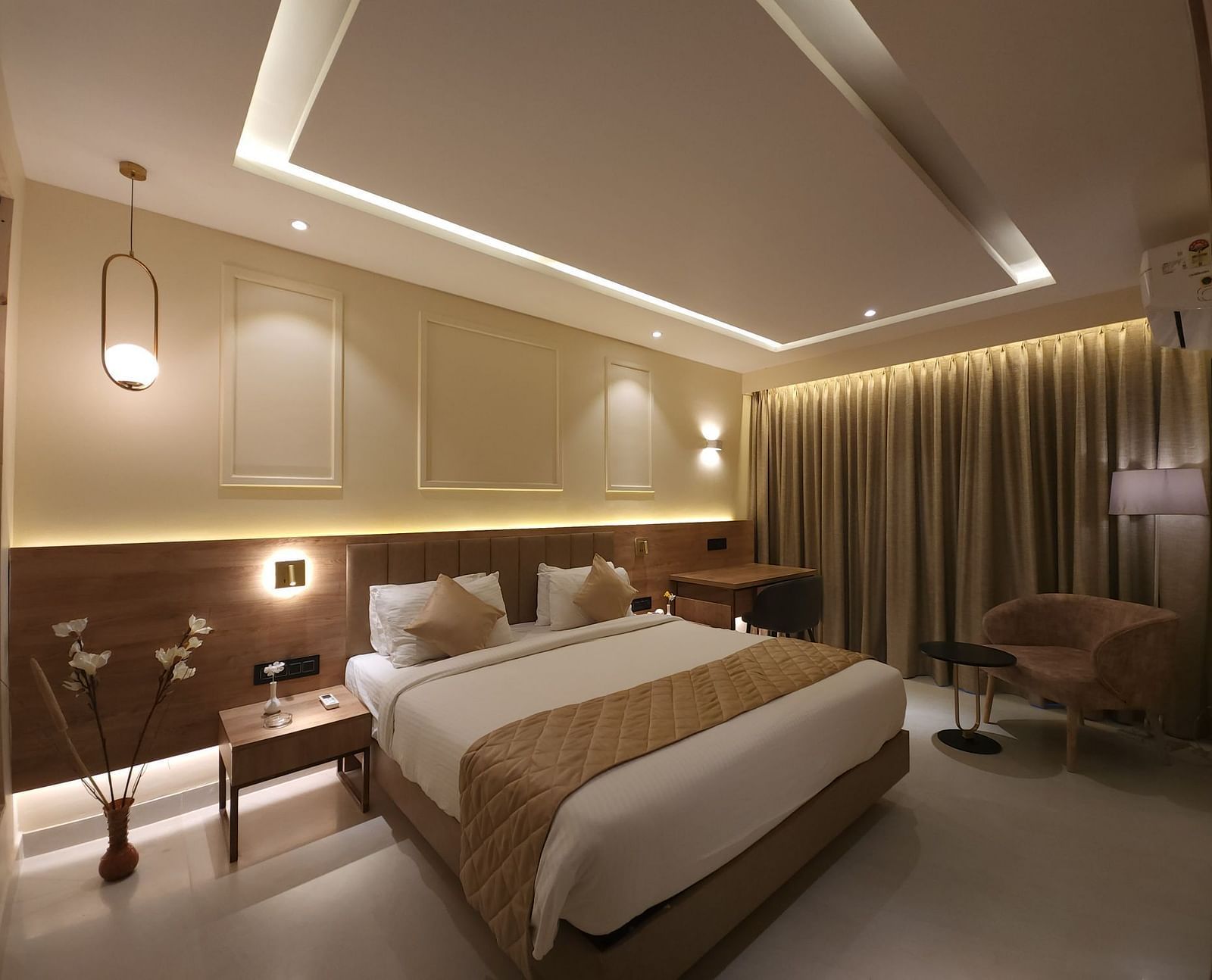 A bedroom with a double bed and side tables