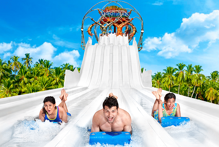 Water Kingdom - 3 people at the end of a water slide at our water park