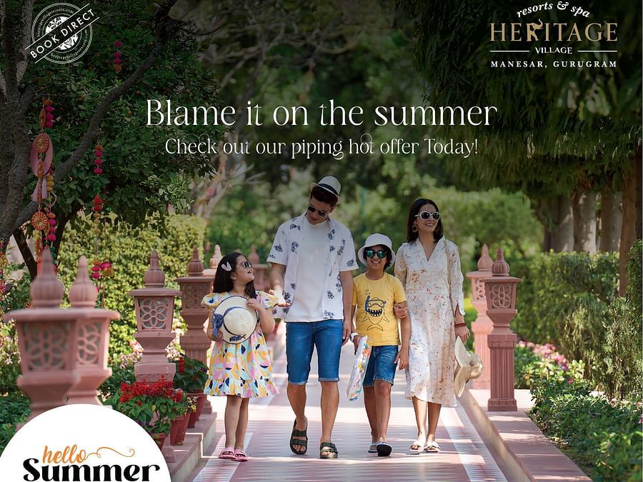 Family enjoying a summer getaway at Heritage Village Resorts & Spa Manesar, promoting a hot seasonal offer with complimentary room and meals for children
