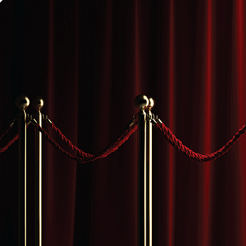 image of a red carpet pathway with a red curtain in the background