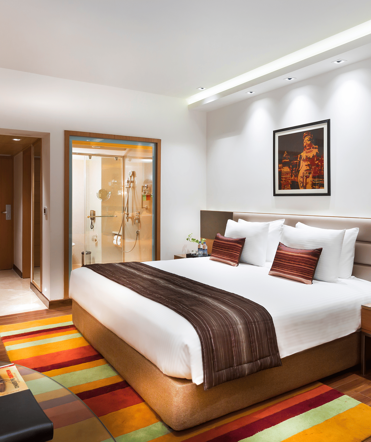 Business Class Room with a king size bed and a TV at Grand Chennai By GRT Hotels.