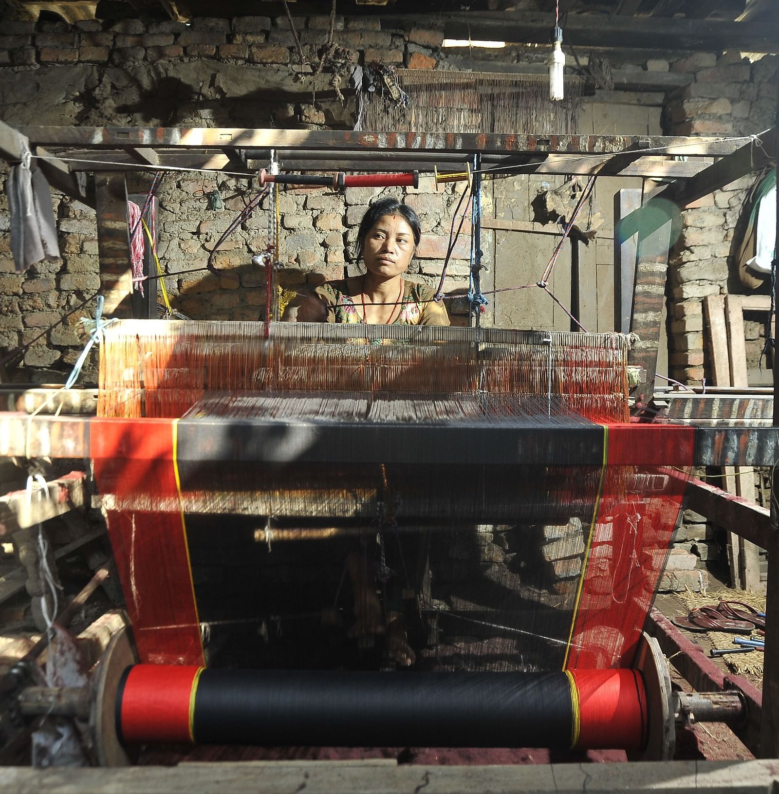 Traditional women's attire, Haku Patashi, is being woven.