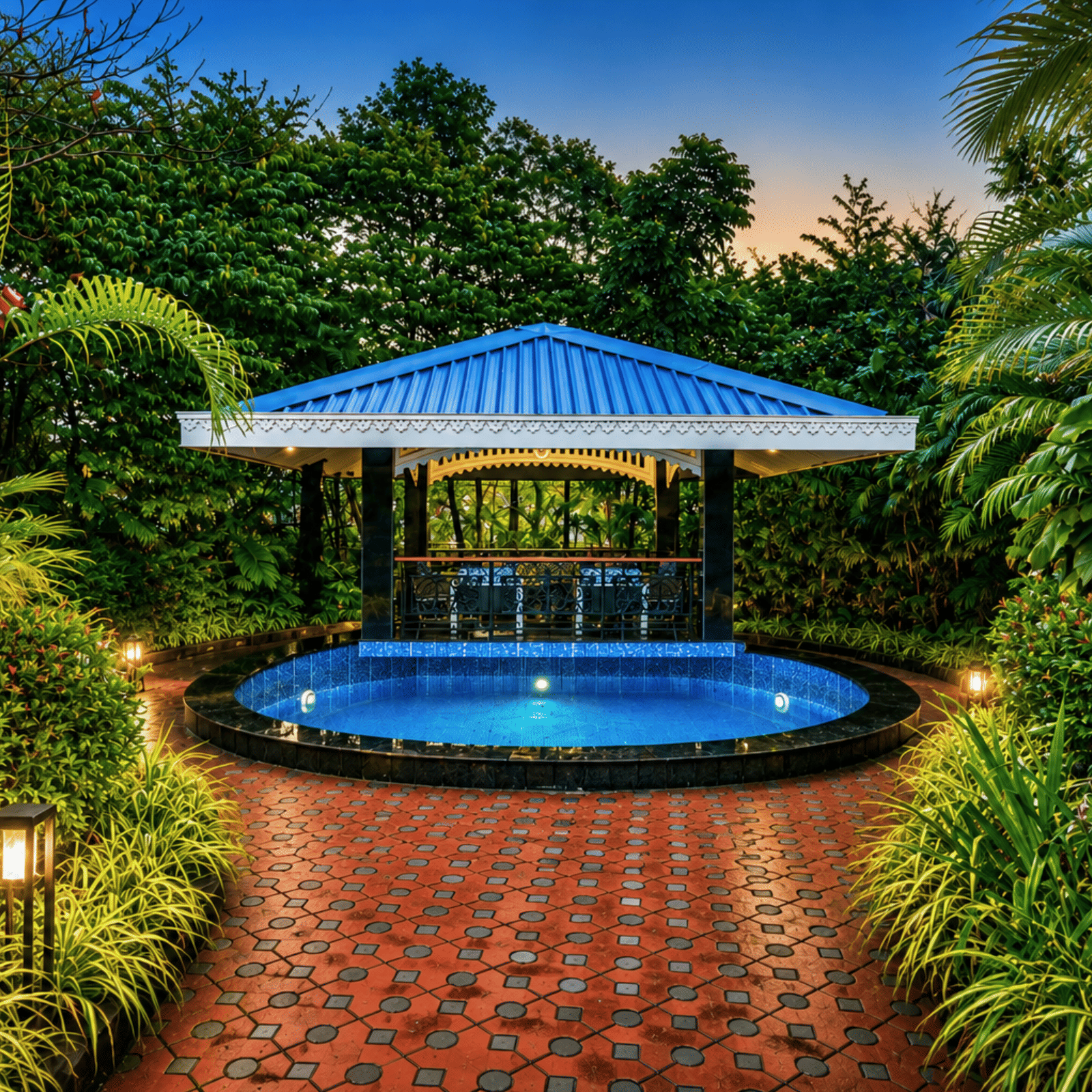 Garden gazebo with a blue pitched roof and a round plunge pool lit at dusk, framed by tropical planting at MAYFAIR Oasis Resort & Convention, Jharsuguda.