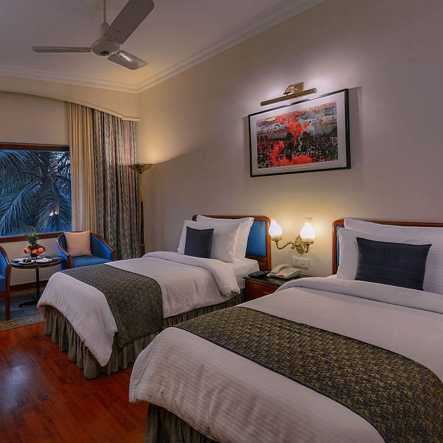 Clarks Varanasi - the twin beds kept beside the window at the Premier Room