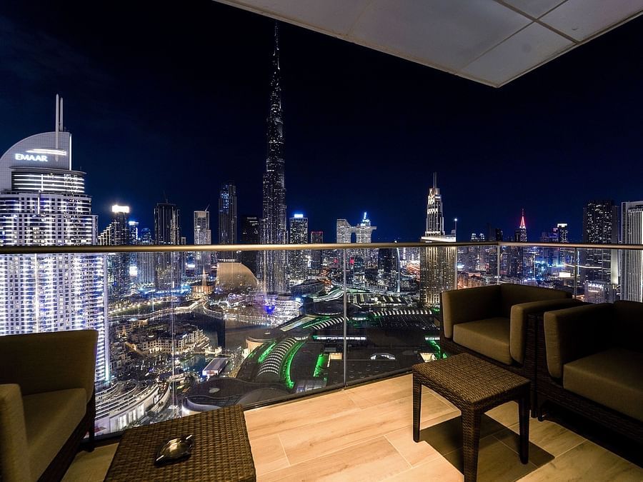 Address Dubai Mal(previously Address Fountain Views) Residence Tower - view of Dubai during nighttime from the seats kept in the balcony