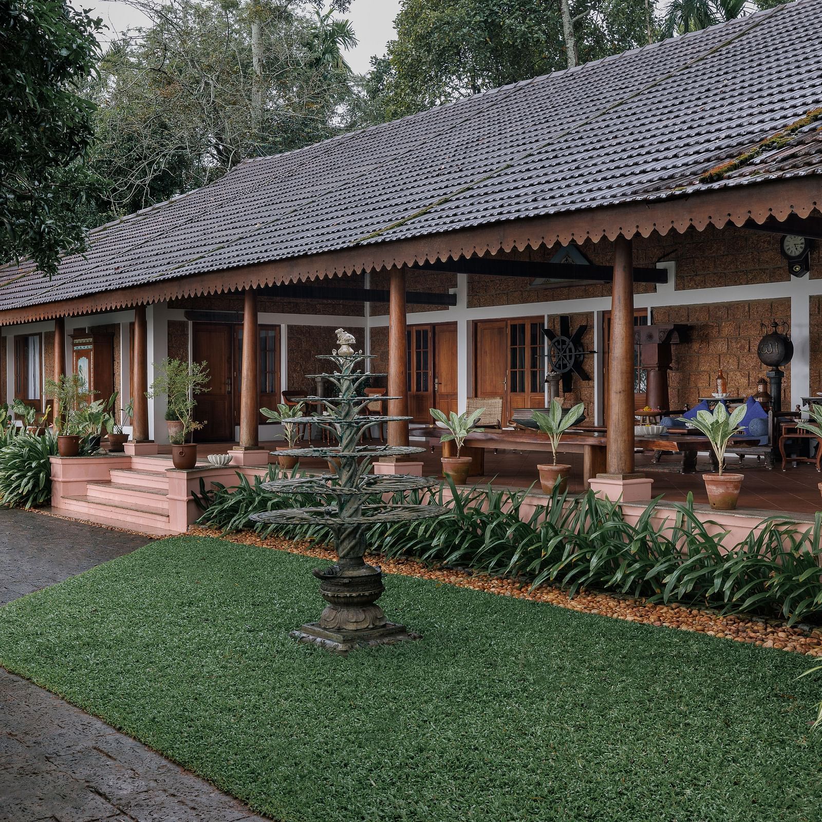 A facade of BluSalzz Villas - Muhamma Resort, Alleppey featuring the villas and greenery around it
