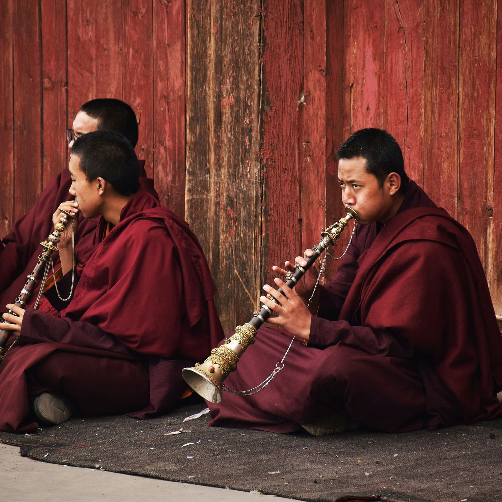 image of a group of Buddhist monks playing traditional instruments