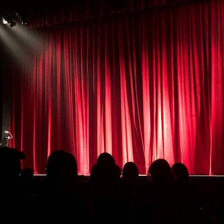  The theatre stage is covered by a curtain