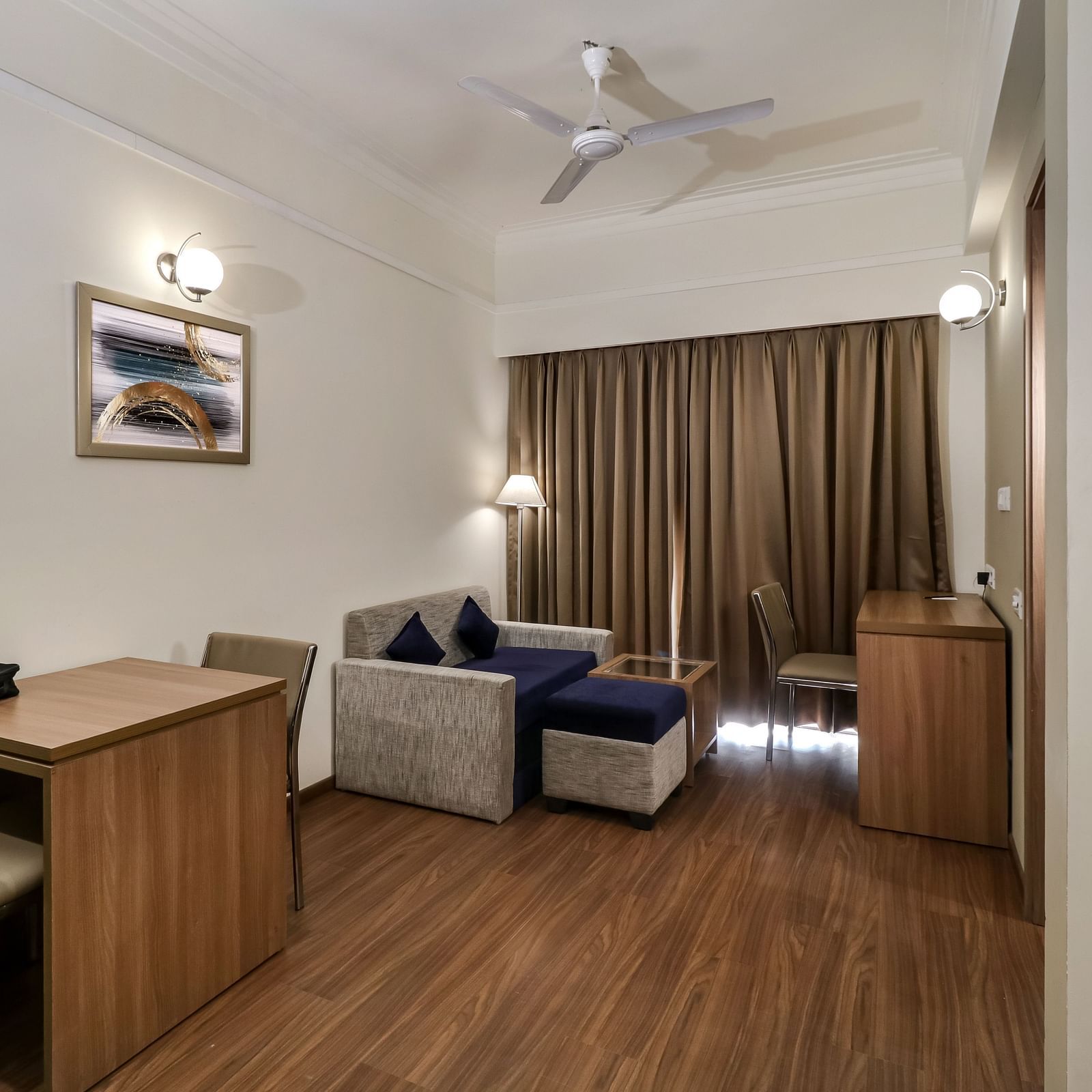 Overview of the living room with Seating Area inside deluxe Suite - Starlit Suites Newtown, Kolkata