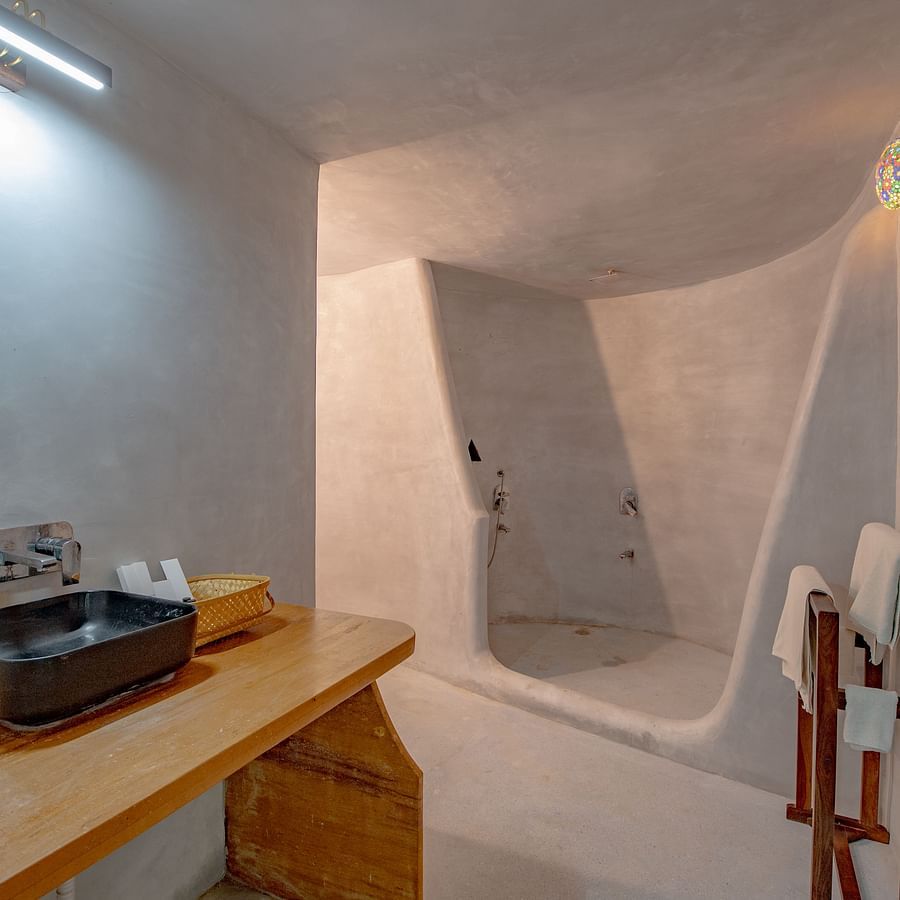 alt-text An image of a bathroom with cabinet and on top there is a sin and toilet utilities