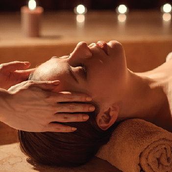 image of a woman getting a head massage