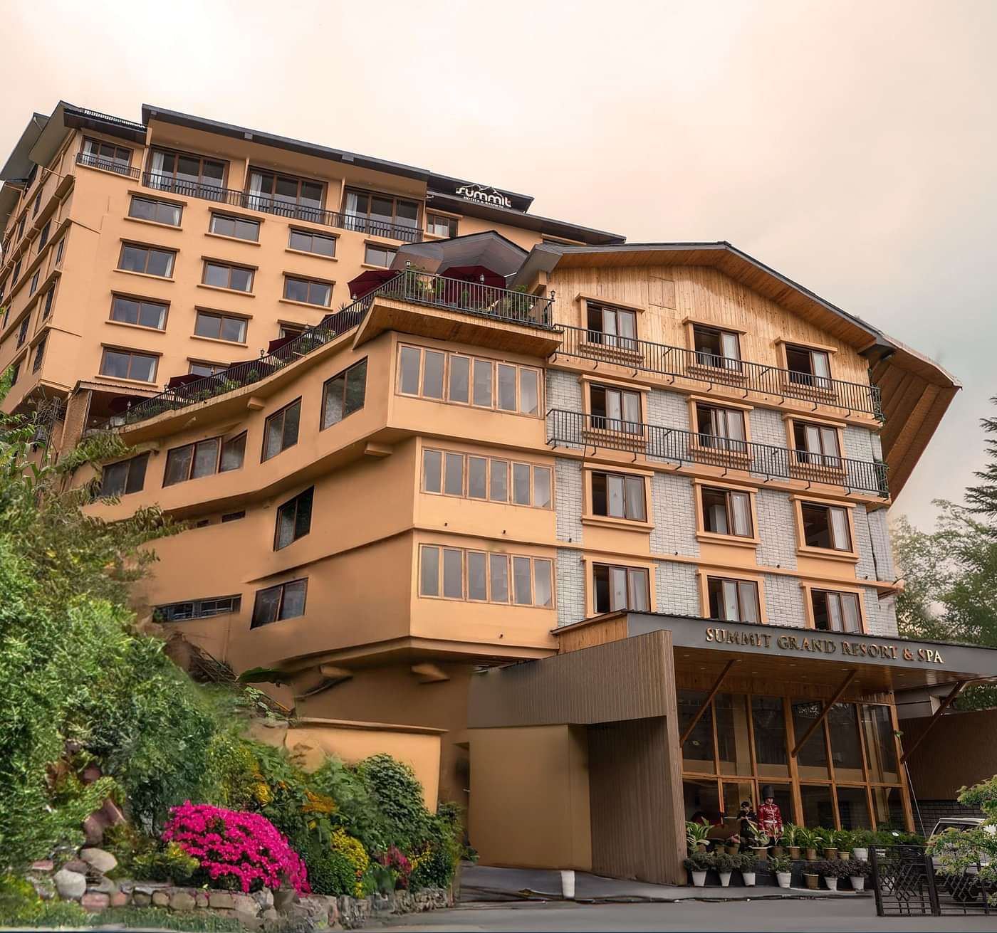 Facade image of Summit Grand Resort & Spa, Gangtok, with trees lining the pathway