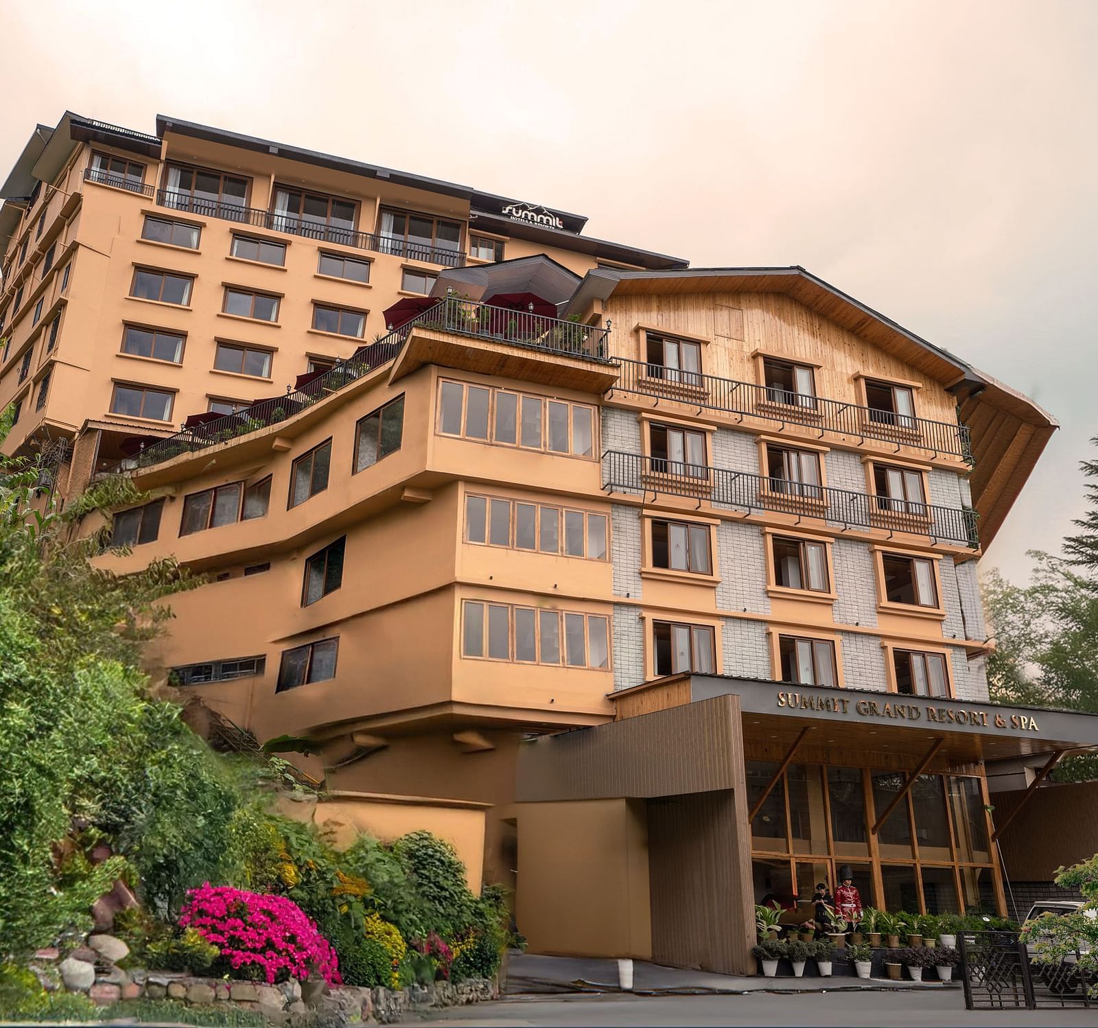 Facade image of Summit Grand Resort & Spa, Gangtok, with trees lining the pathway