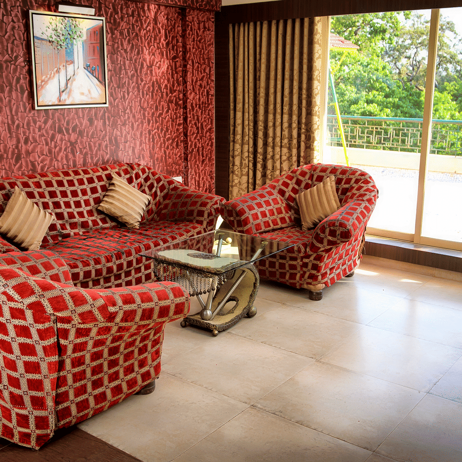 Royal Suite living area featuring sofas and a big widow.