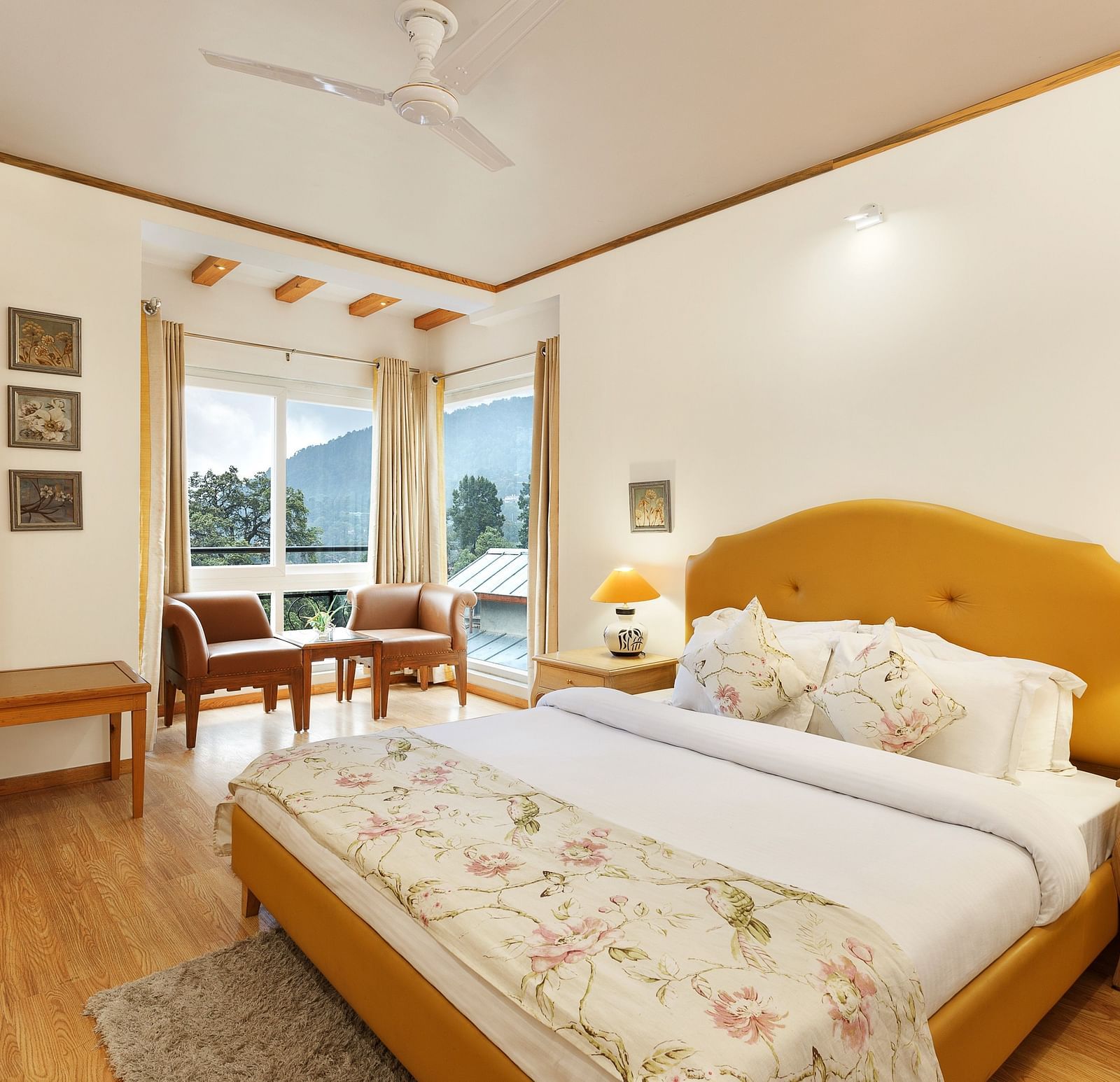 A cosy room with plushy bed, table lamp with makes the ambience homely - Pinewood Nainital 