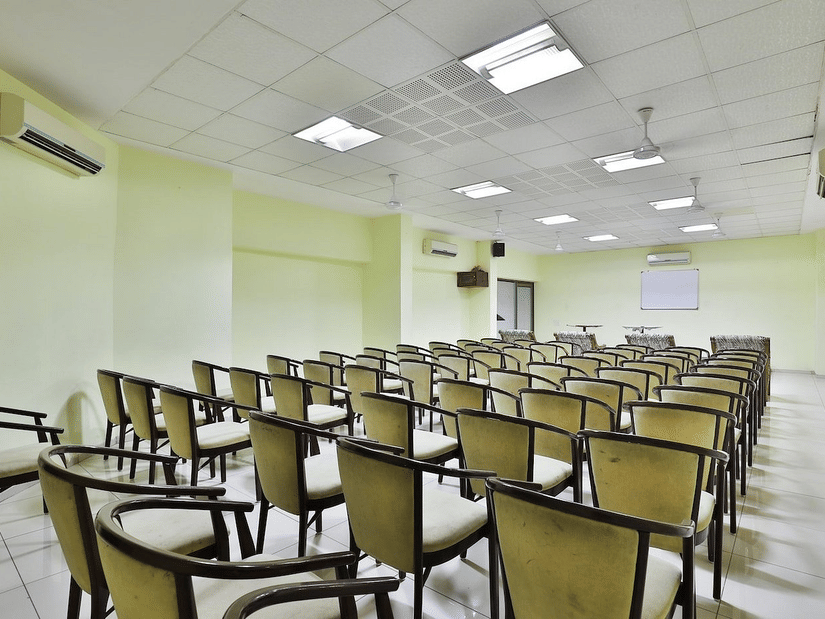 A conference hall with chairs facing the stage at VITS Select, Bharuch.