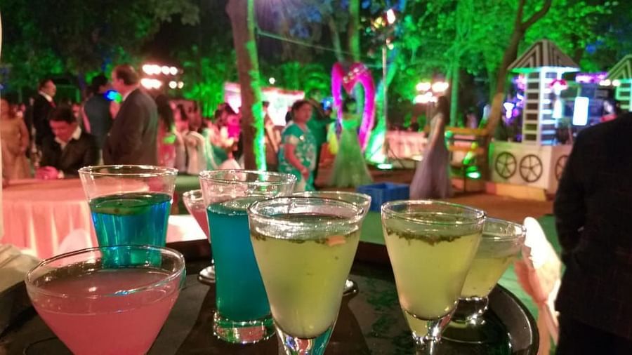 a serving tray with colourful drinks served on glasses - Zara's Resort 1