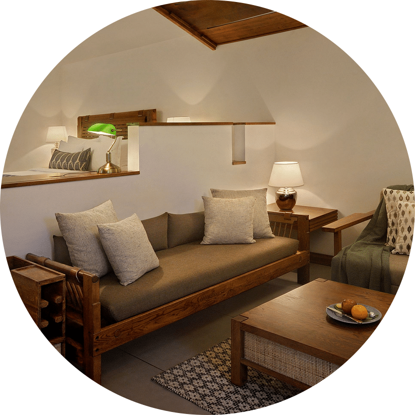 Cozy bathroom with a candle and skylight at Amanvana Spa Resort, Coorg - Luxury Resort