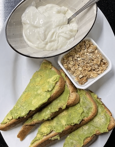 a delicious serving of the guacamole toast complemented with Greek yogurt and cereals at the Cheoah Dining Room - Historic Tapoco Lodge
