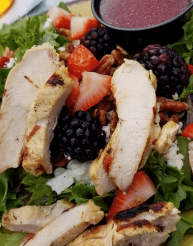 a healthy salad with stripes of chicken along with green leafy vegetables at Tapoco Tavern - Historic Tapoco Lodge