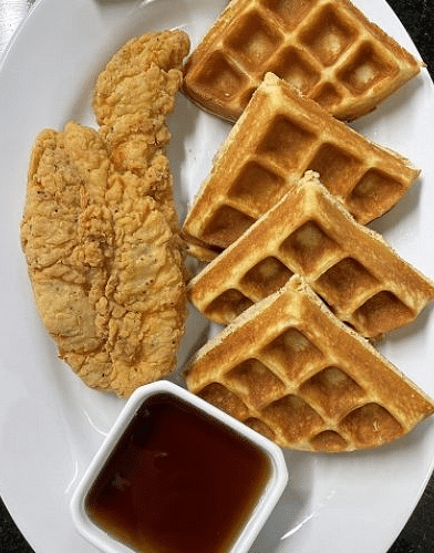 a serving of waffles cut into four pieces served with maple syrup - Historic Tapoco Lodge