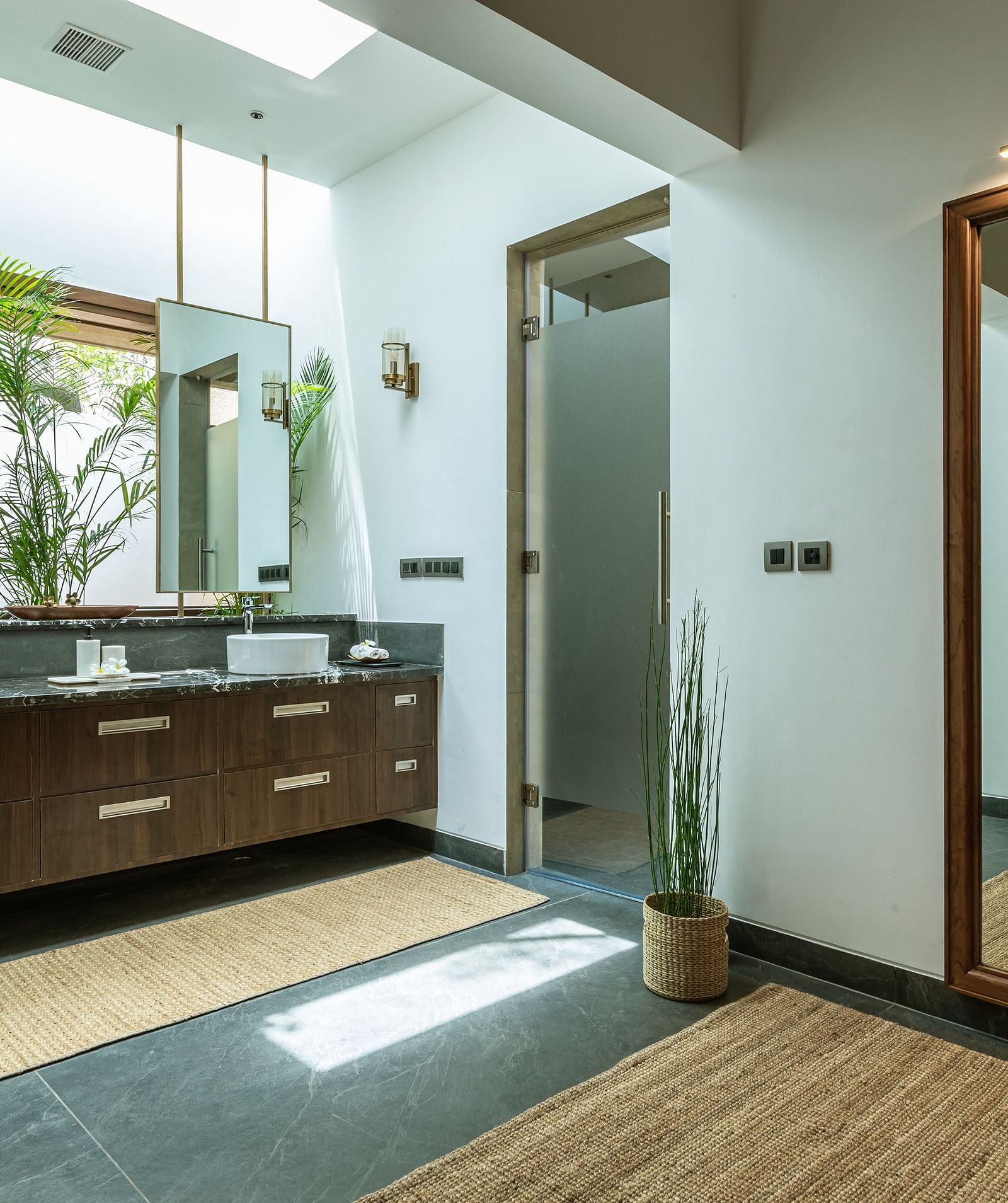 Bathroom with double sinks, mirrors, and a full-length mirror, modern design, tiled floor - Shreyas Retreat