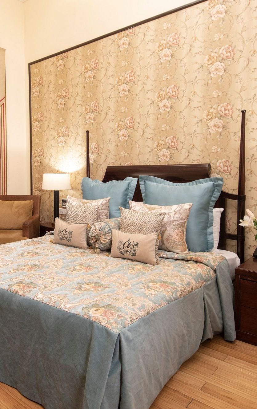 view of the king sized bed in a duplex family suite at the Claridges Nabha Residence, Mussoorie