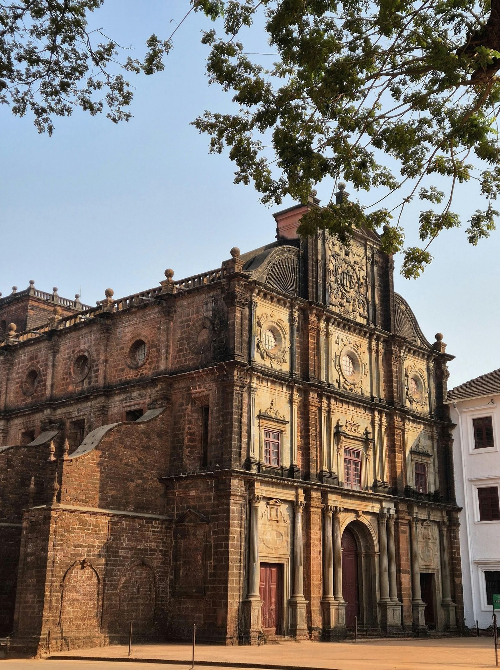 Exterior shot of Basilica of Bom Jesus Church taken from the corner of a street on a bright morning.