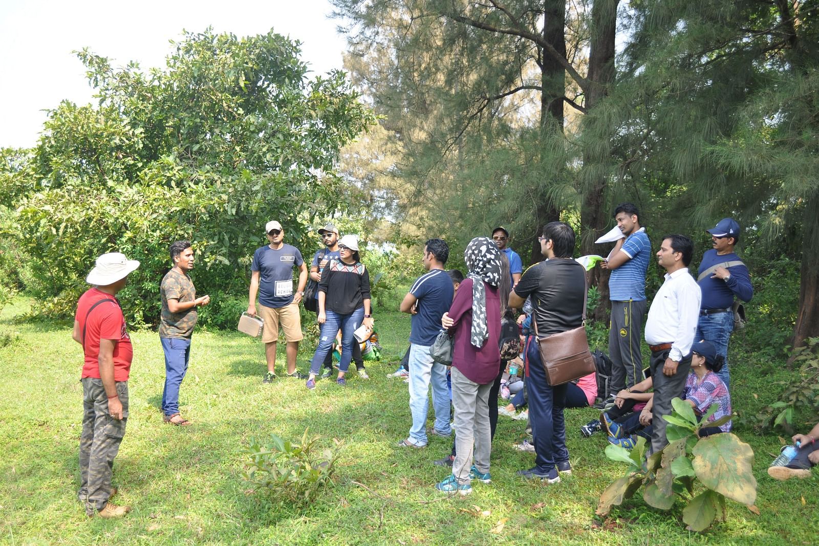 Guests at Forest Escapes Koyna participate in an outdoor activity in a natural setting.