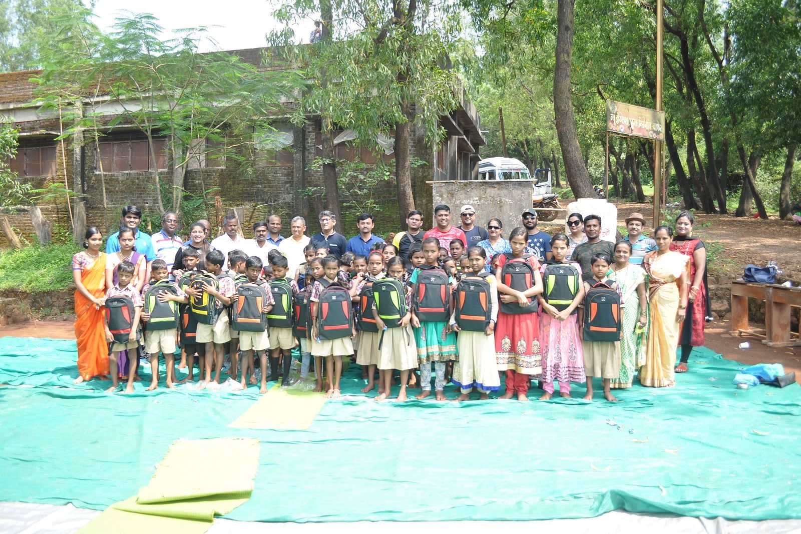 A large group of people at Forest Escape are gathered outdoors, possibly after enjoying one of the resort's many activities or events.
