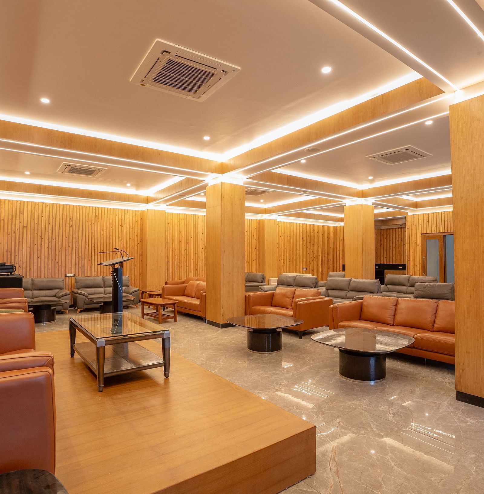 event hall with brown sofas at Summit Grand Resort & Spa