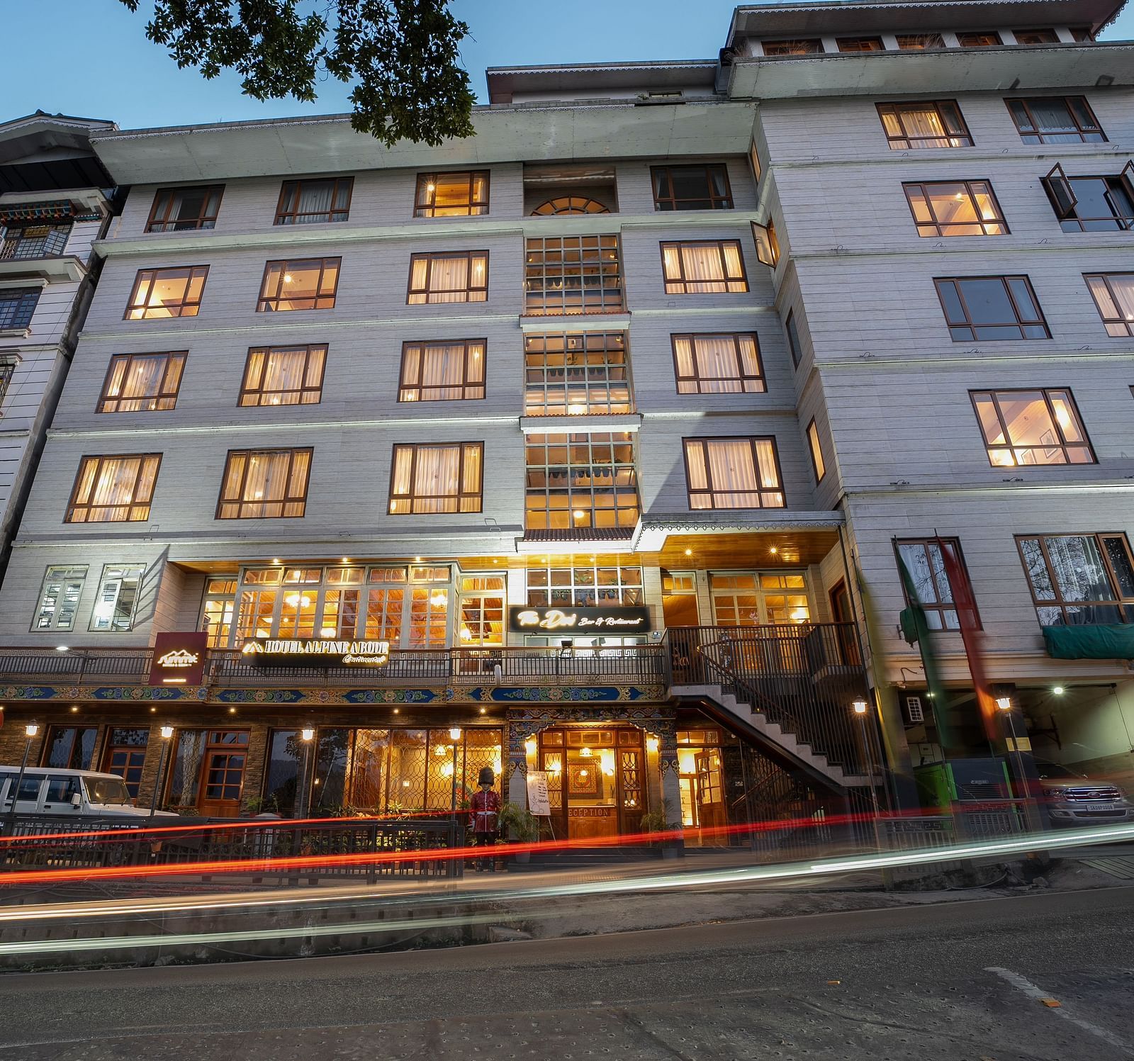 Facade image of Summit Alpine Abode Hotel with the building illuminated by lights