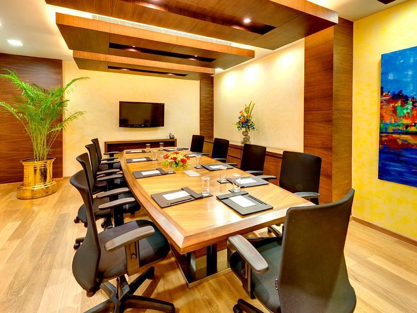 a meeting room table with chairs in a business centre - Kenilworth Hotel, Kolkata