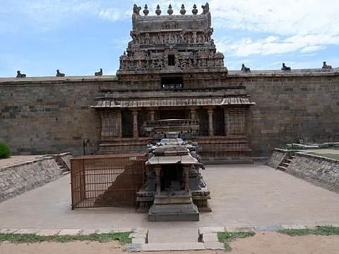 View of the grand temple structure at Dharasuram, with detailed sculptures and steps leading up to the entrance