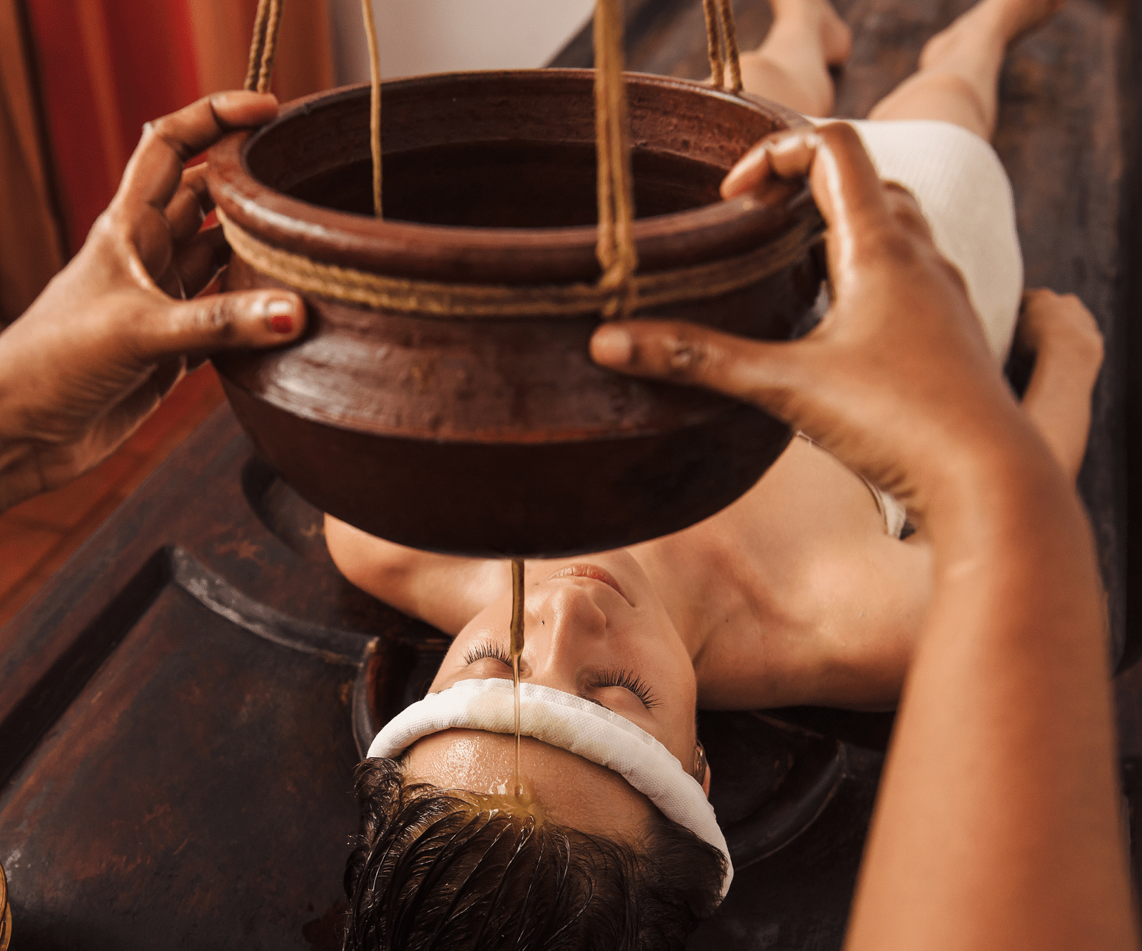 an image of Shirodhara treatment - Kerala Ayurveda - Rhythm Kumarakom