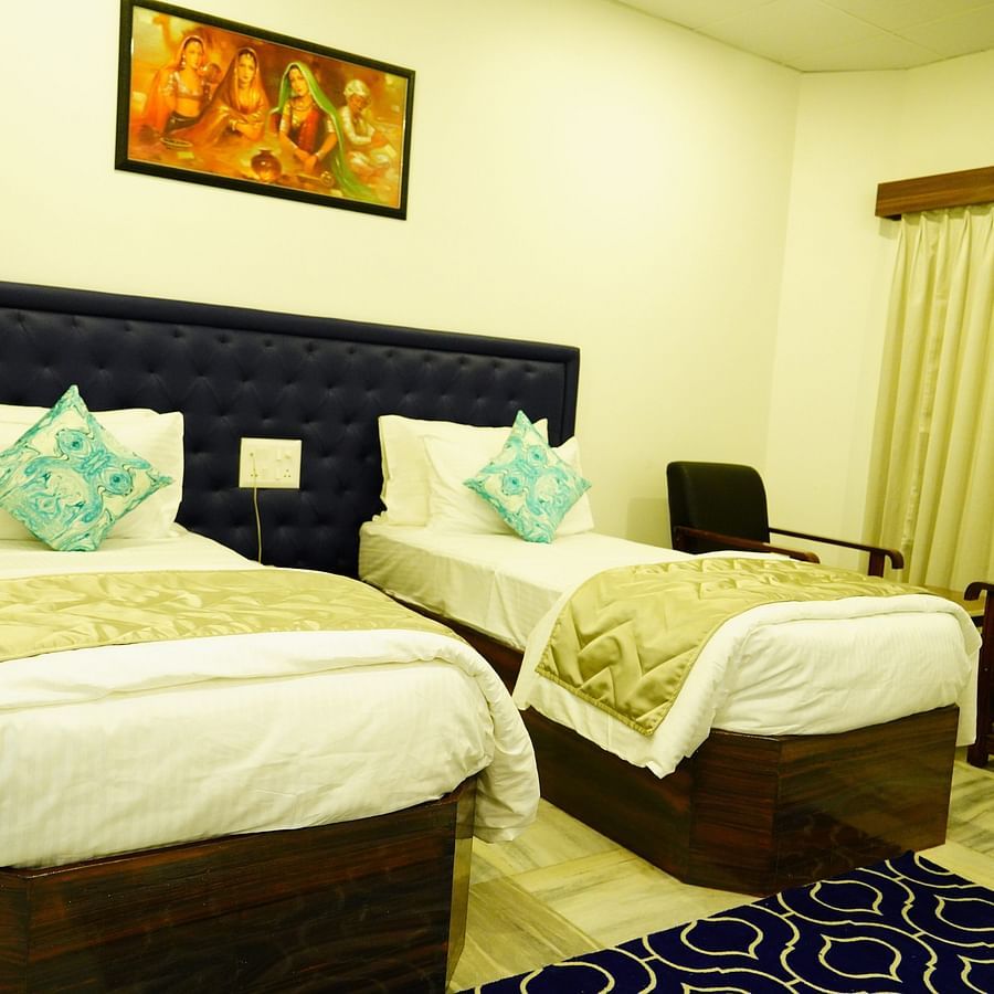A full view of the bedroom with twin beds and bedding