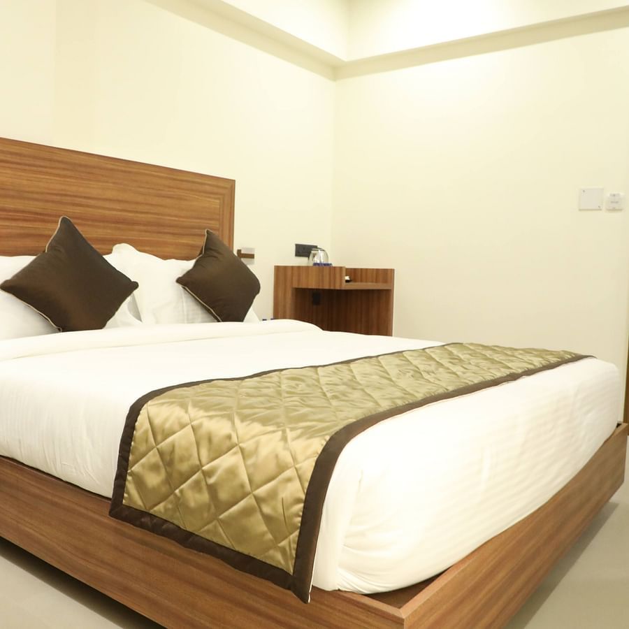 An image of a bed with bedding