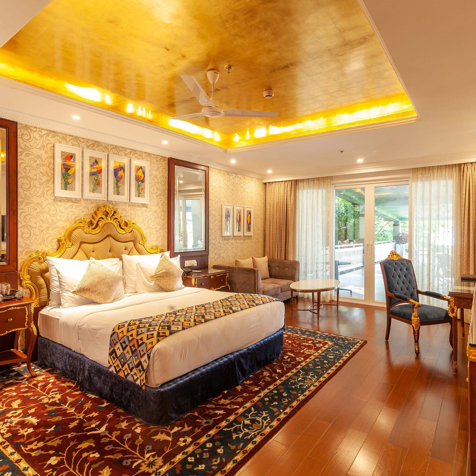 a king size bed facing the TV and a dressing mirror on its left - Mayfair Lake Resort, Raipur