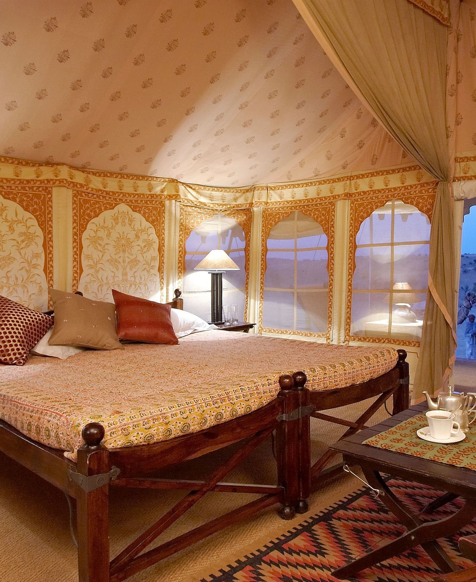 Interiors of the standard tent with a double bed and side tables