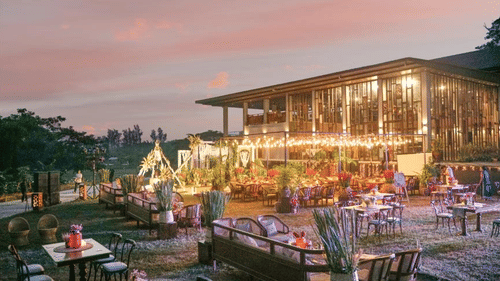 an outdoor event area all lit up with lights and decorated with flowers for an event at Symphony Samudra Beachside Jungle Resort And Spa, Port Blair