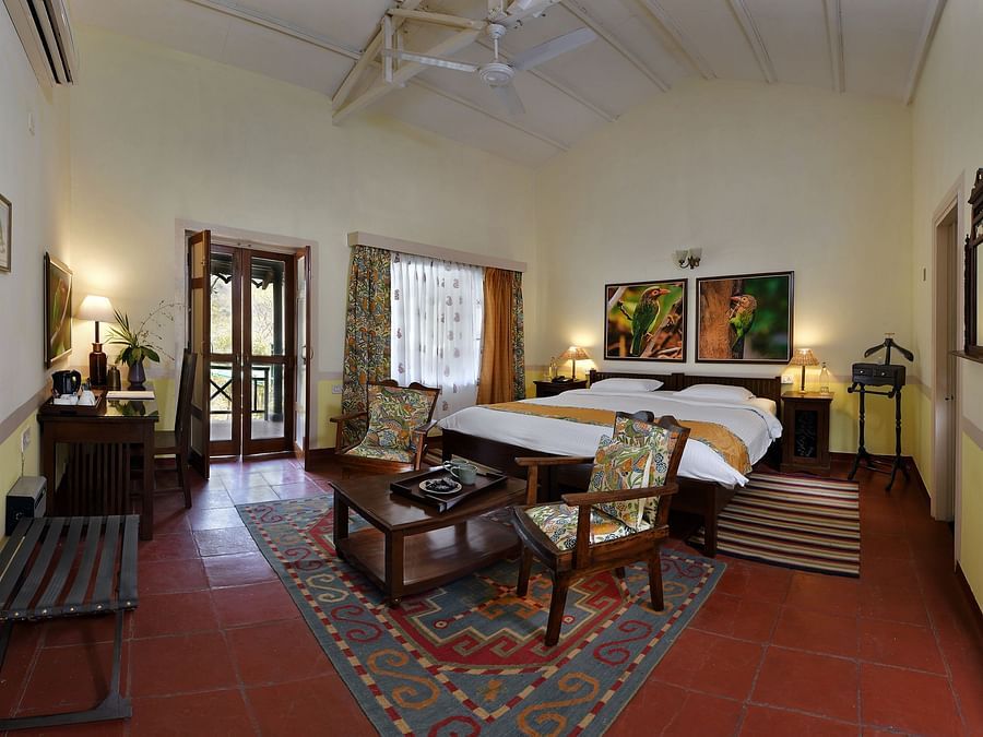 Barbet room comprising of a bed, coffee table and chairs 