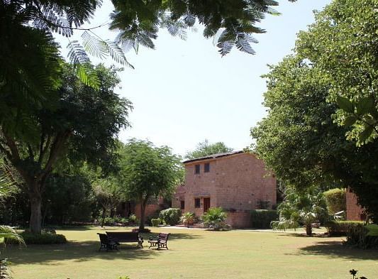 An image of the outdoor seating area with lush greenery around  - MANVAR Resort & Desert Camp
