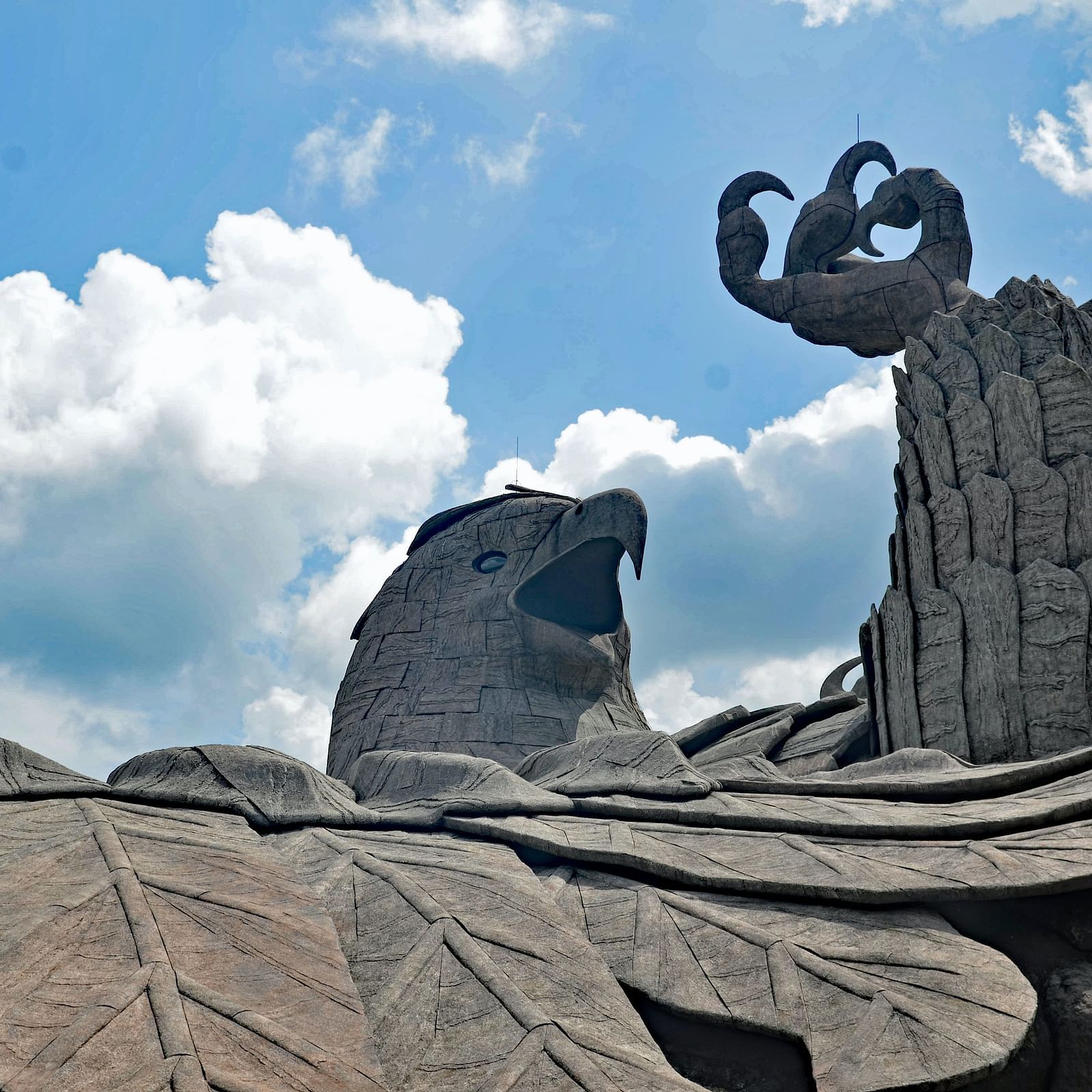 Eagle carved into the rock face, lying in the grotto