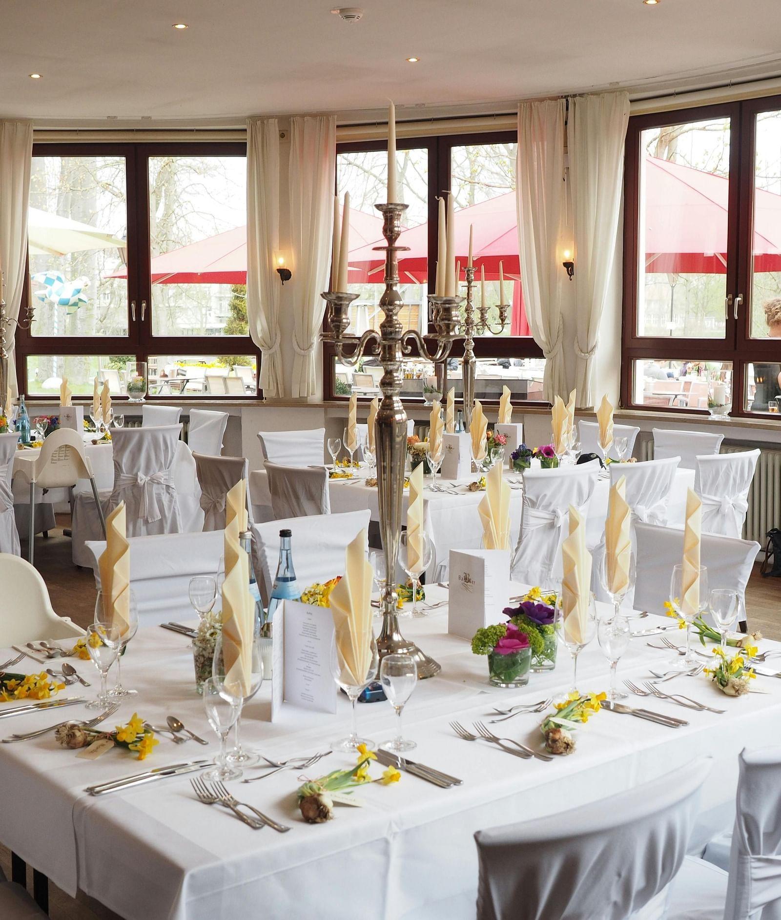 A beautifully decorated Banquet Hall, adorned with elegant lighting, floral arrangements, and festive décor, setting the perfect atmosphere for celebration