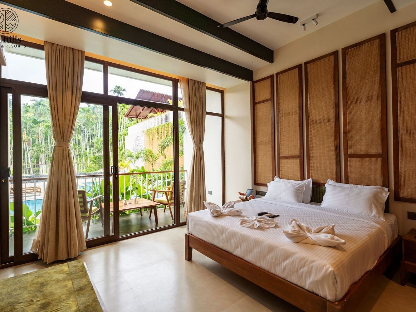 Well-lit bedroom featuring ample natural light, a comfortable bed, and scenic views of greenery outside - Sea Hills Resort, Swaraj Dweep (Havelock)