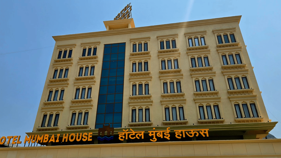Daytime view of hotel exterior with modern façade at Hotel Mumbai House, Digha, Airoli.